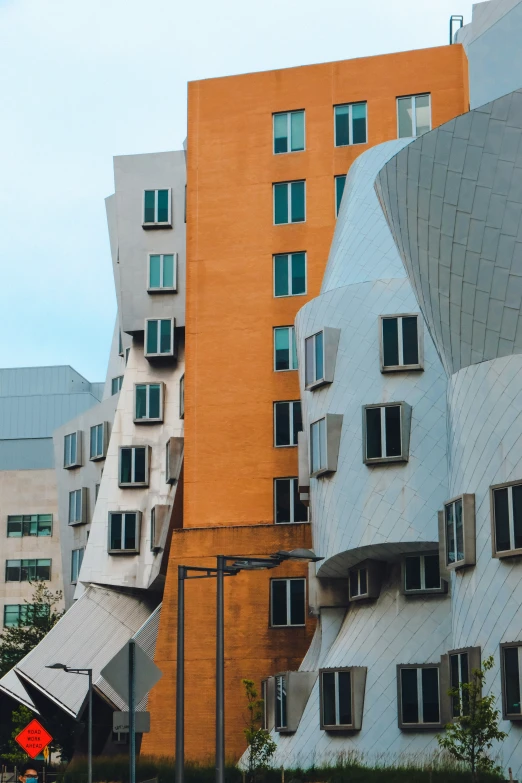 a building with curved windows sits in the foreground