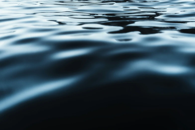 the water is very blue with dark clouds