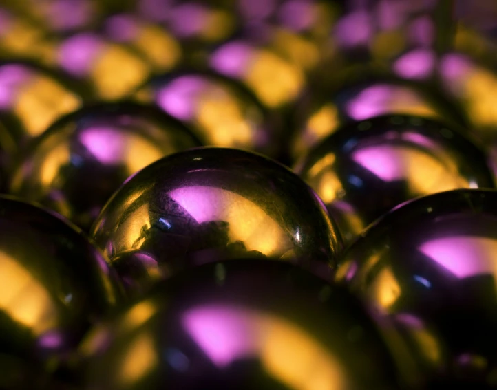 a close up s of balls of purple and yellow