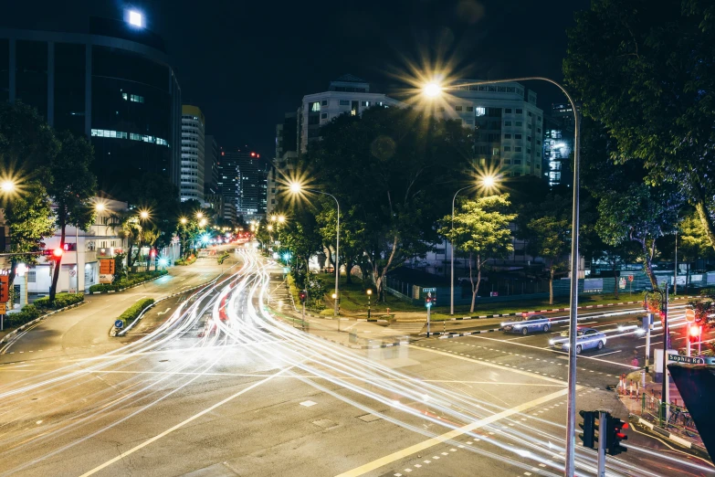 the city street is lit up at night