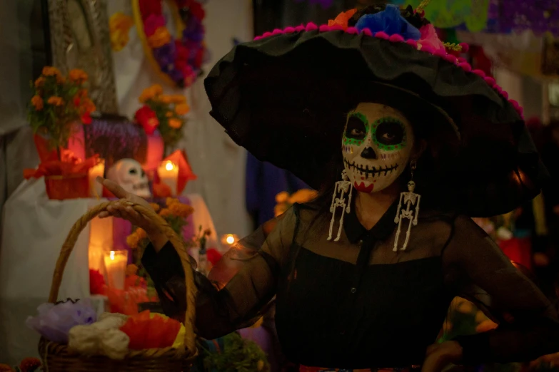 a woman wearing makeup, skull jewelry and holding an umbrella