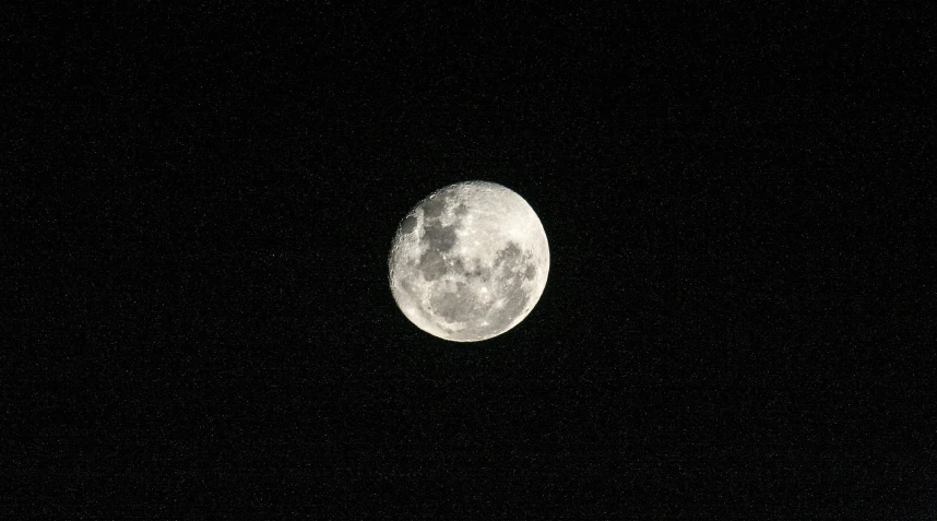 the full moon seen from a distance with no clouds