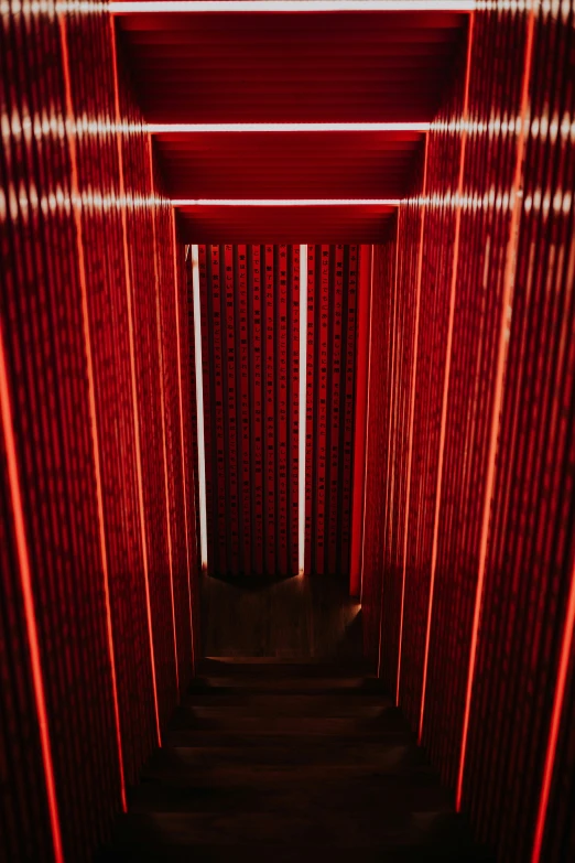 there is a long red hallway with red lights on it