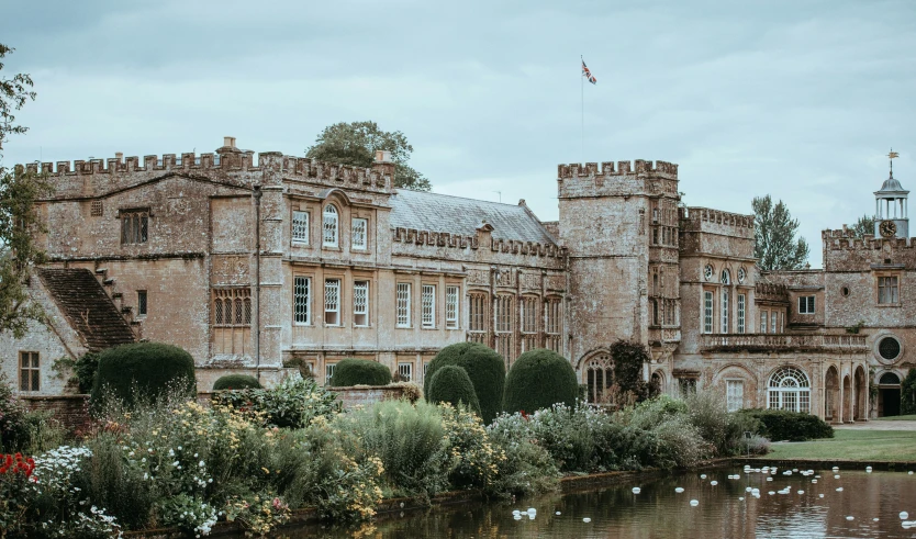 a large building with a lake in front of it