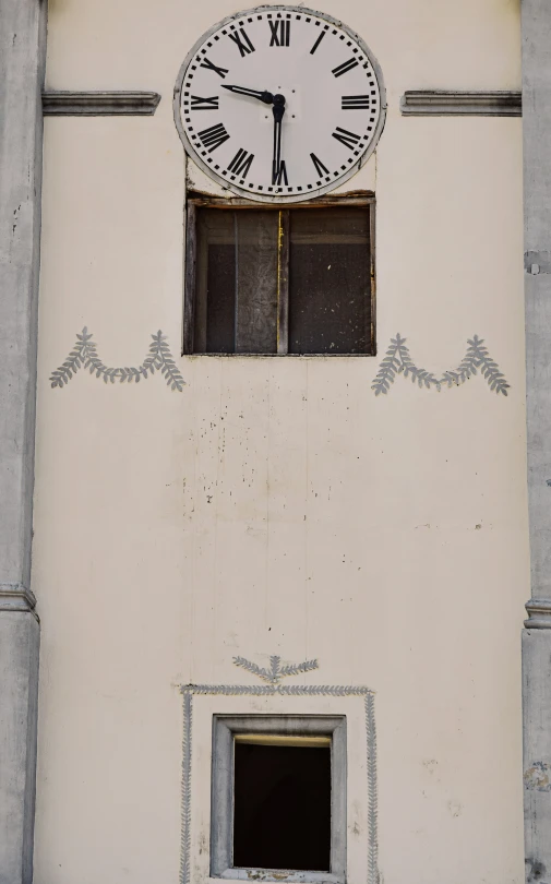 an image of a white and black clock on the wall