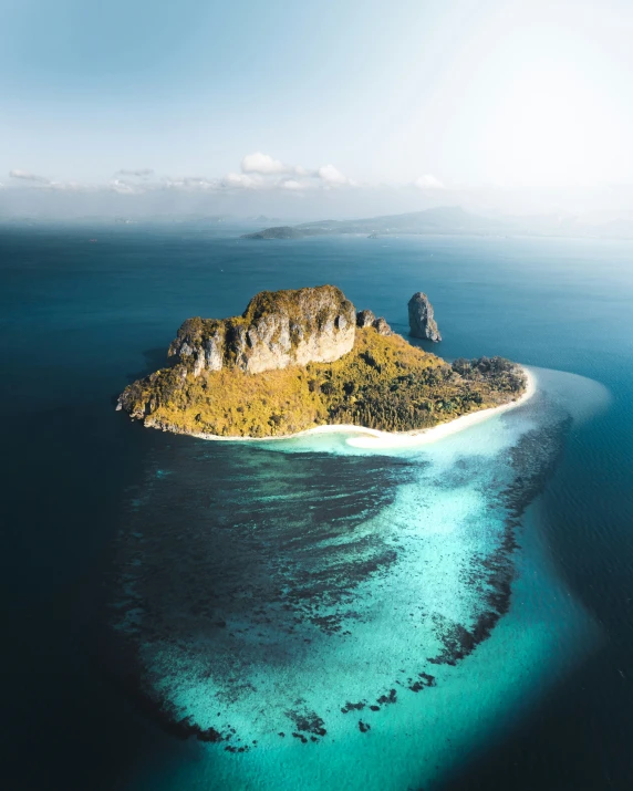 an island sits on an uninhabited island in the ocean