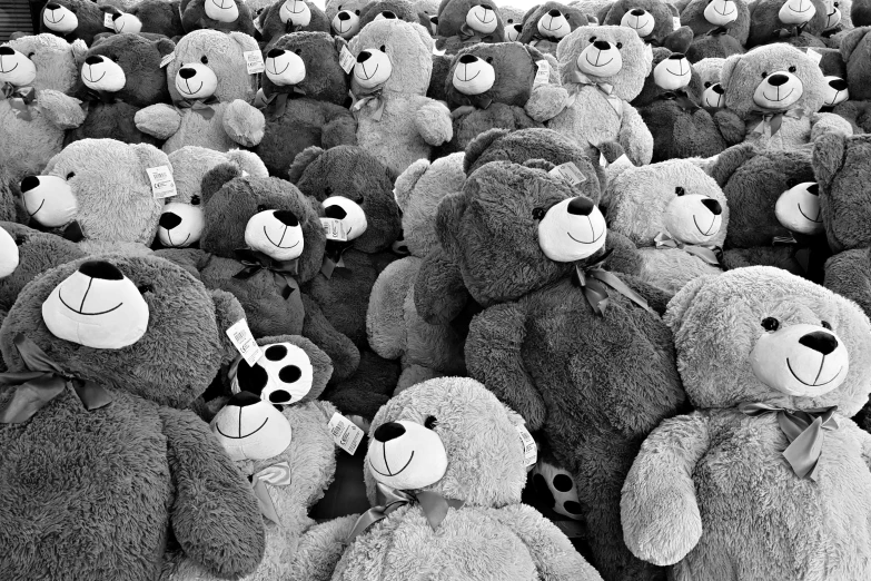 a group of big stuffed animals with numbers on their noses