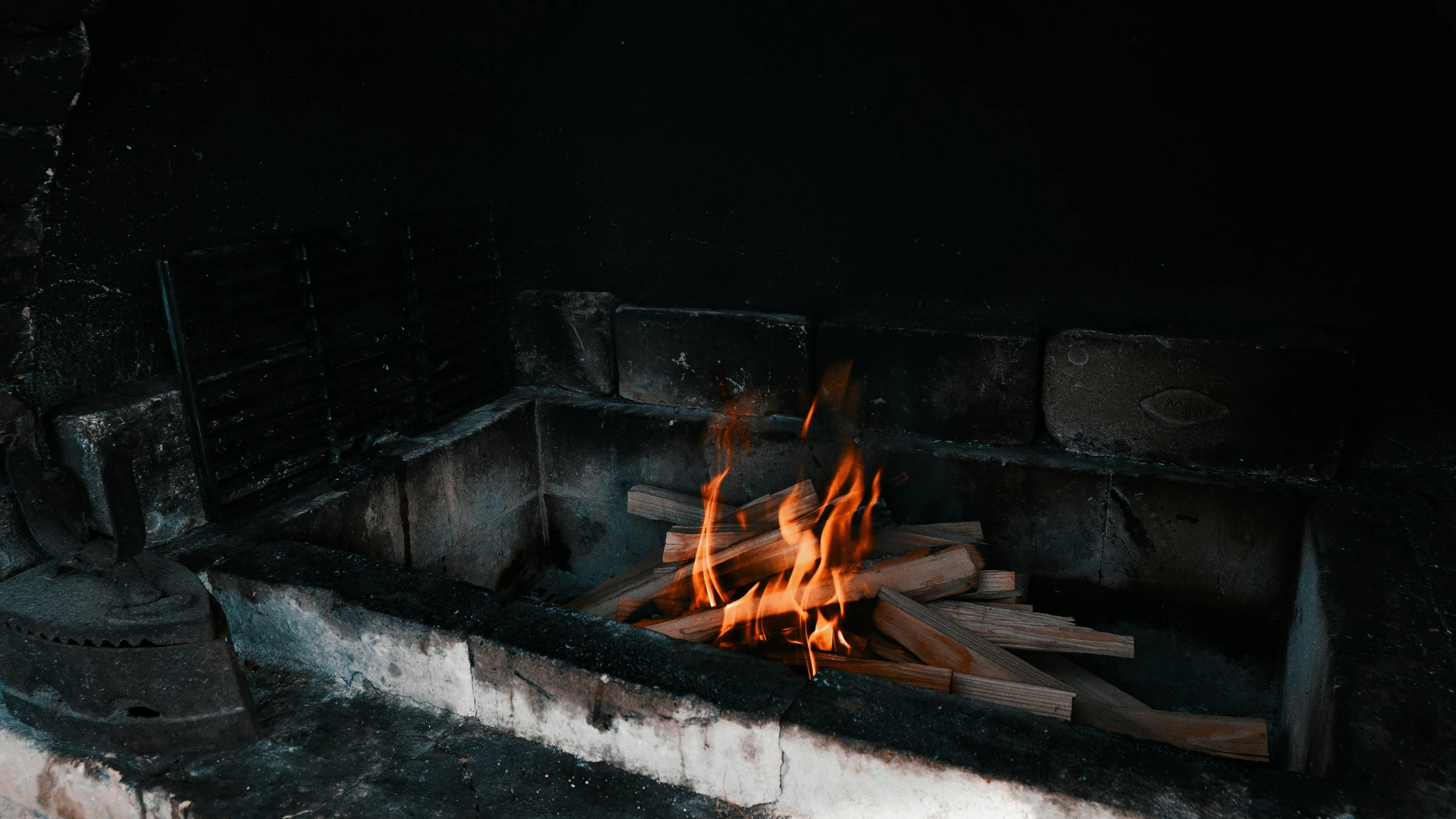 a fireplace filled with fire and sticks