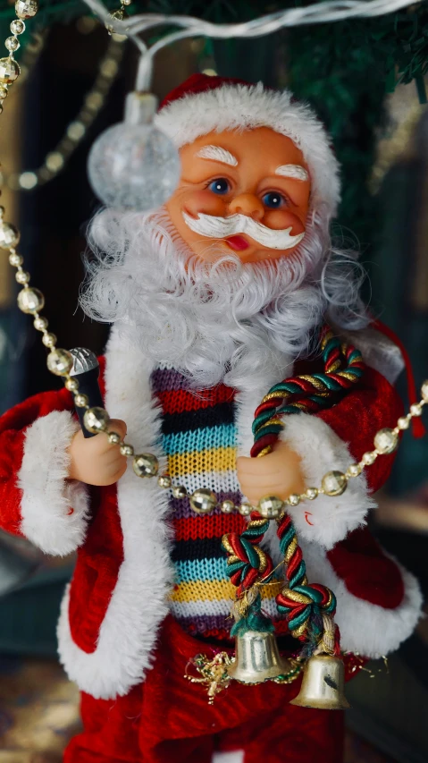 a close up of a christmas decoration with santa clause