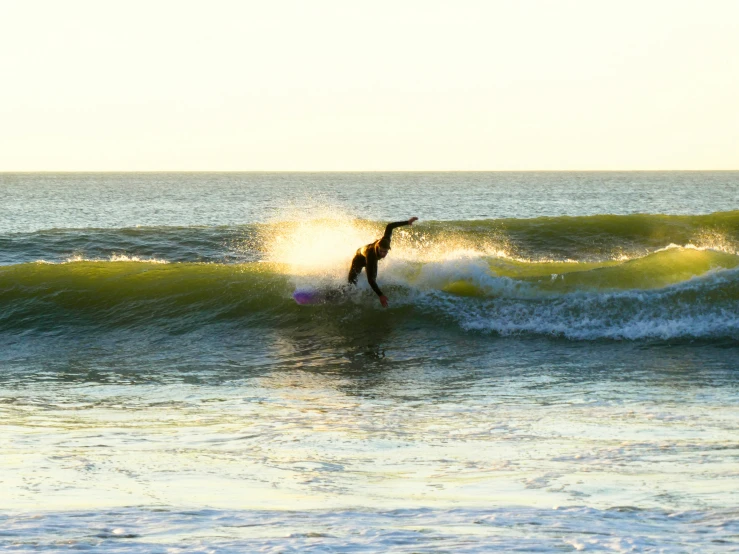 a man on a surfboard in the ocean