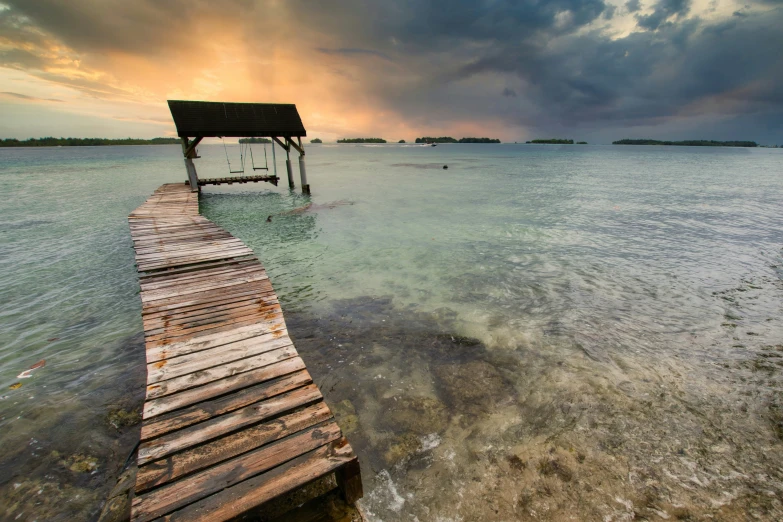 a dock is shown in the middle of a body of water