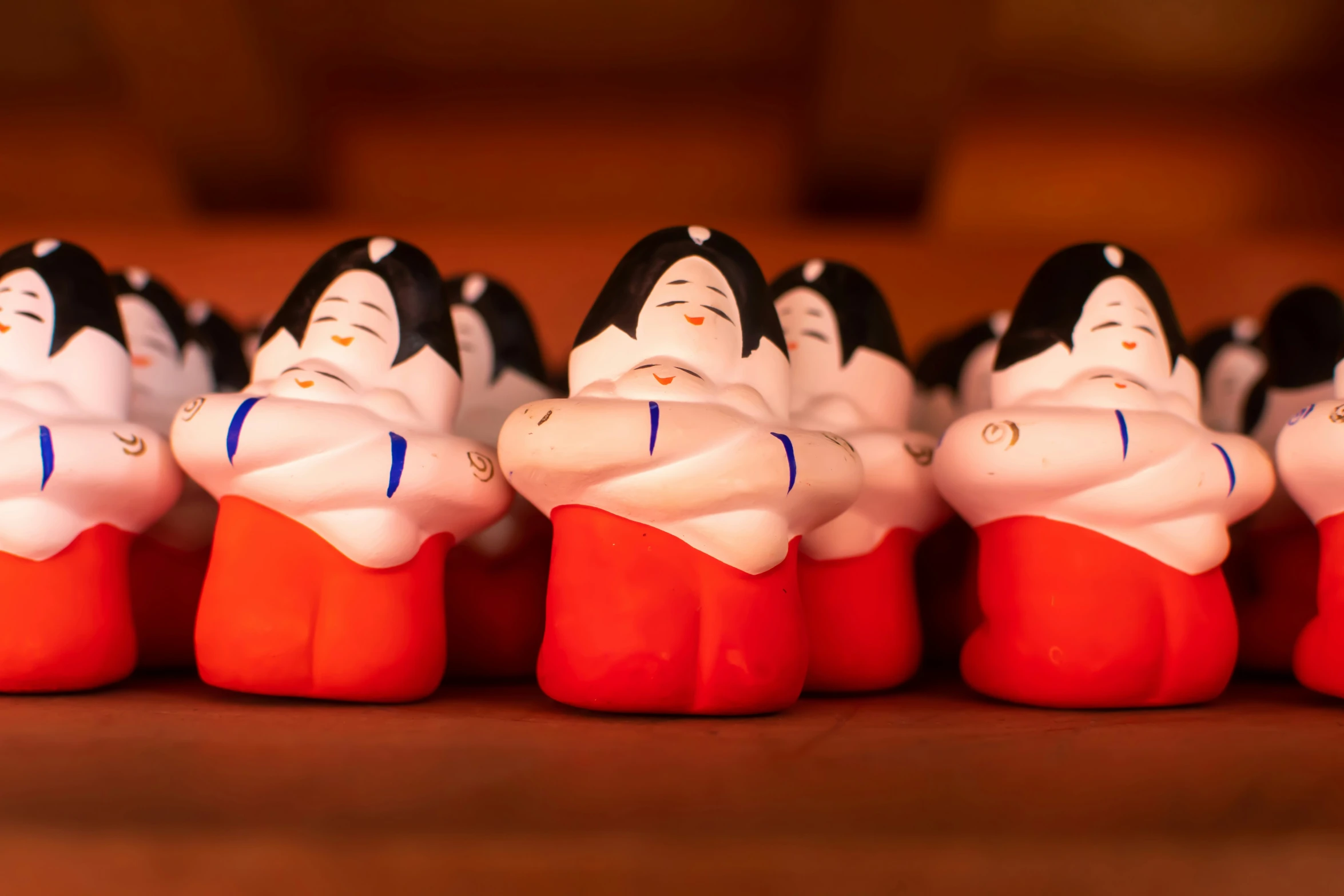 a group of small figurines standing side by side