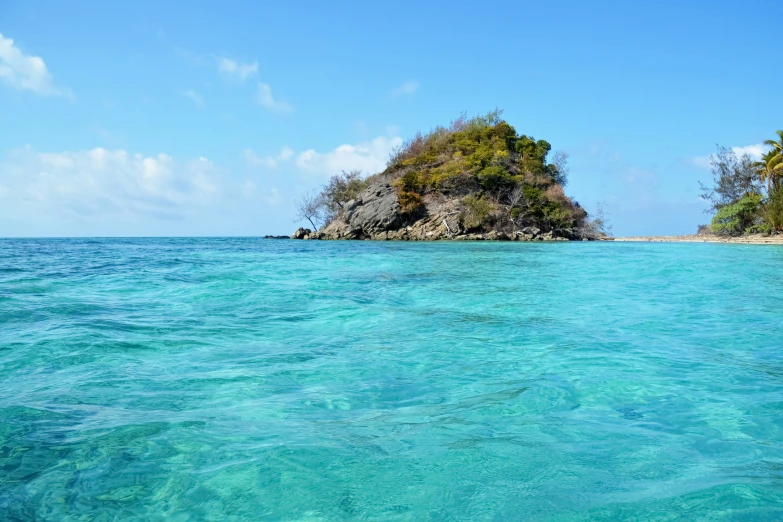 clear water in the ocean near a small island