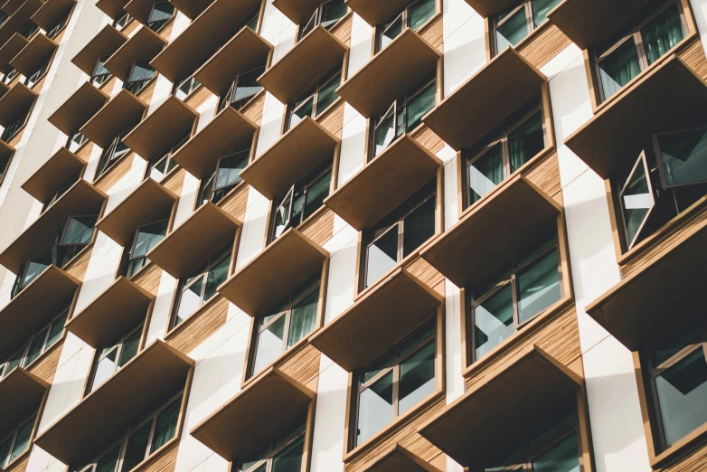 an apartment building with a tall window on top