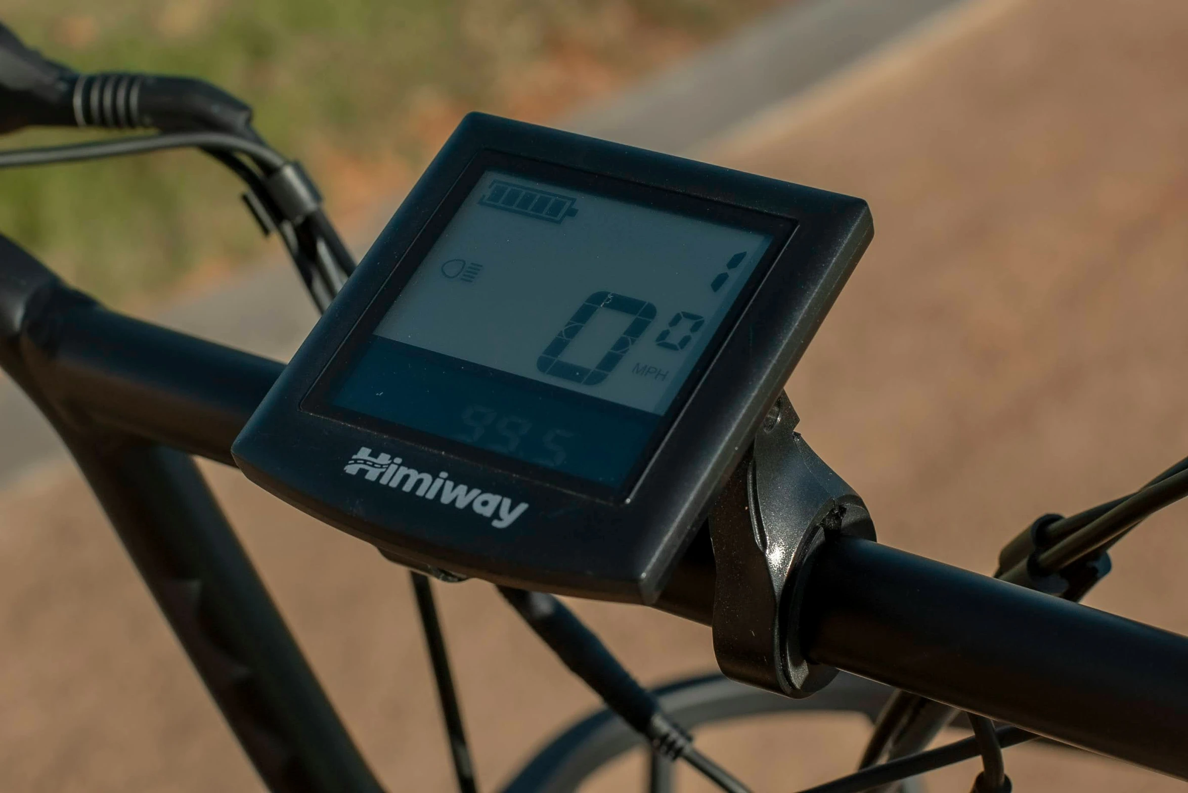 a bicycle monitor sitting on the front ke of a bike