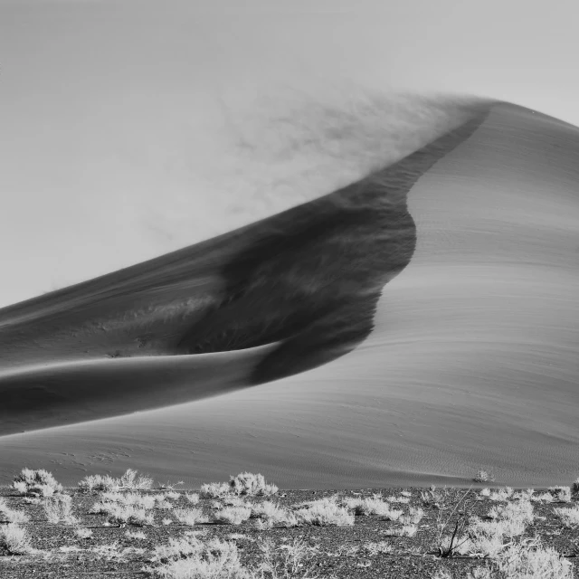 black and white po of a mountain and sky