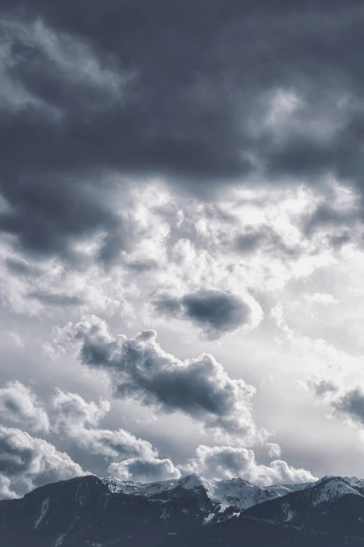 a black and white po of a plane flying in the sky