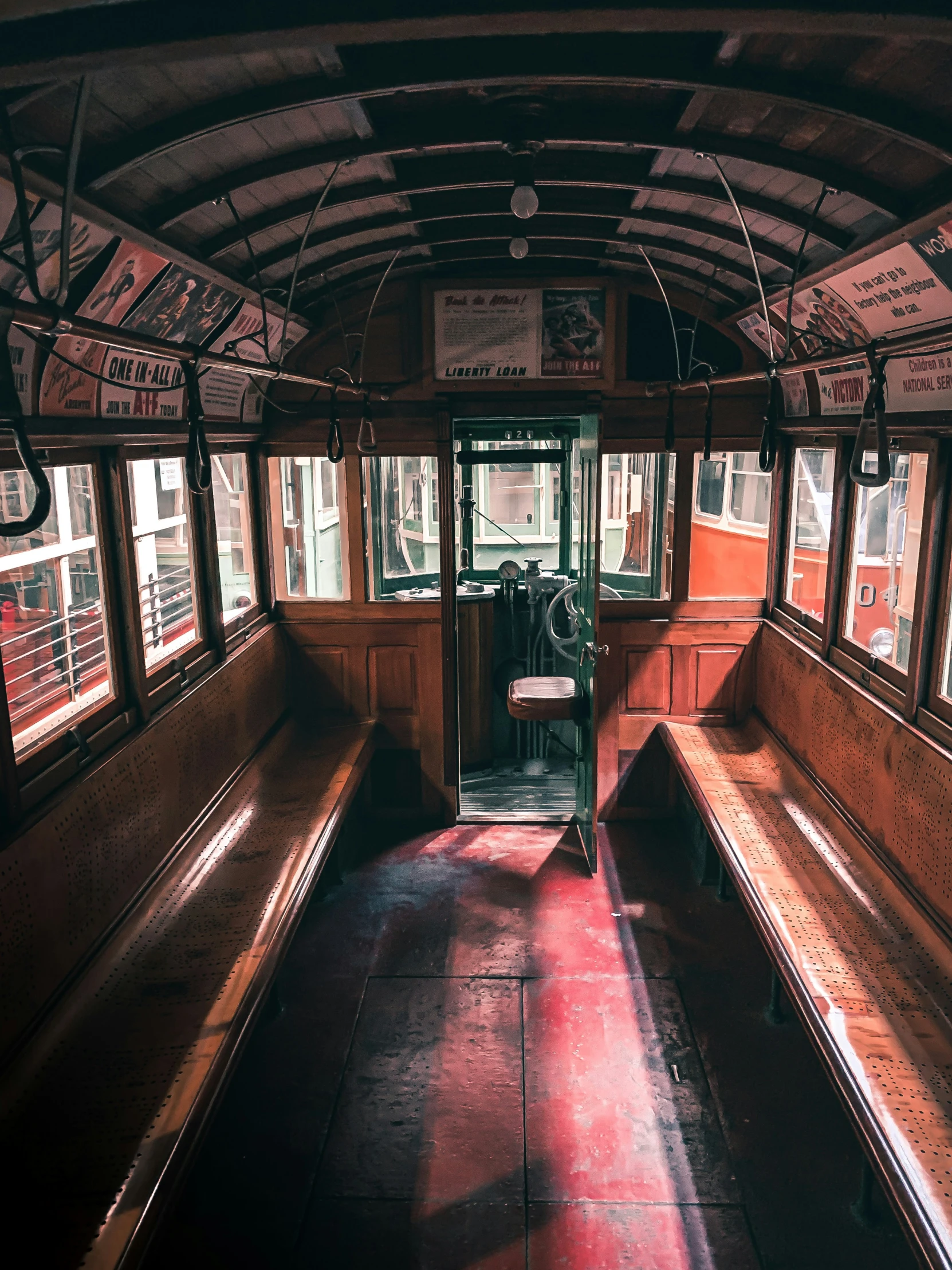 there is some seats sitting inside of a bus