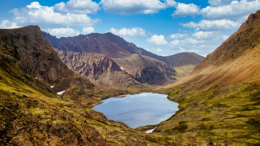 the mountains are filled with water and some plants