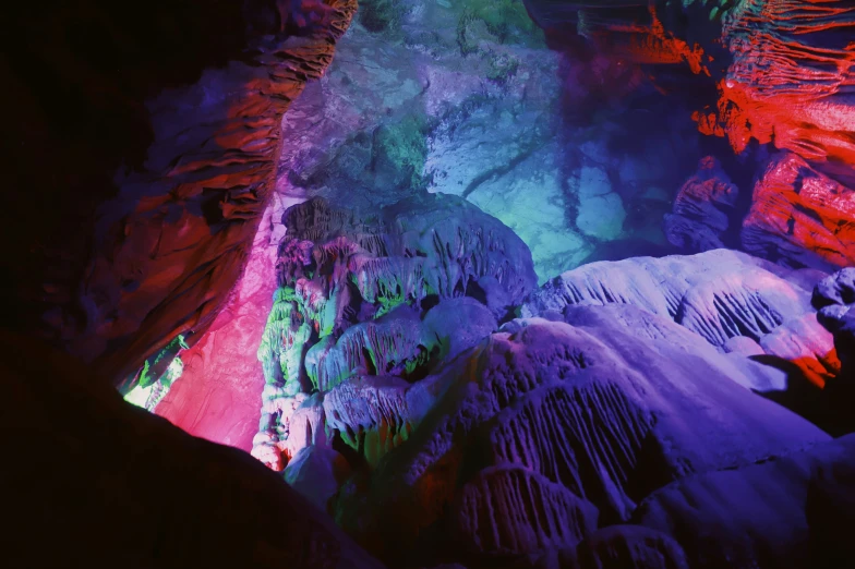 there are colored rocks and formations in this cave