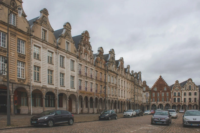 a row of buildings in front of a sidewalk