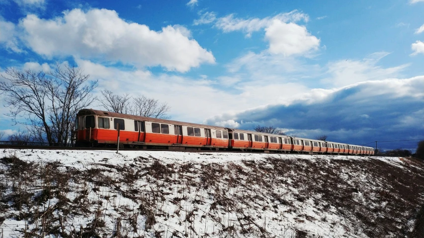 the train is traveling through winter on snow