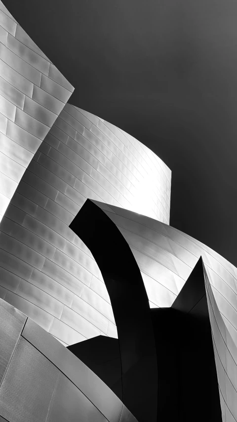 modern architecture showing a curved white object with one section missing
