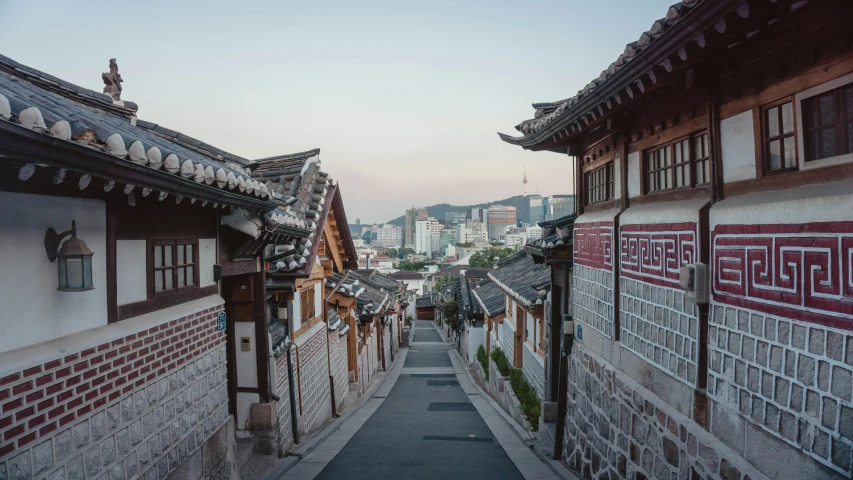 a long walkway between two buildings with lots of windows