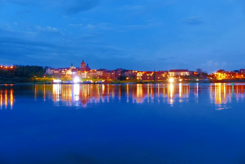 a lake with buildings and water in it