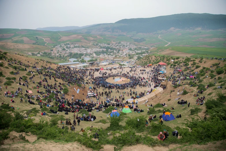 several people standing around a large open field