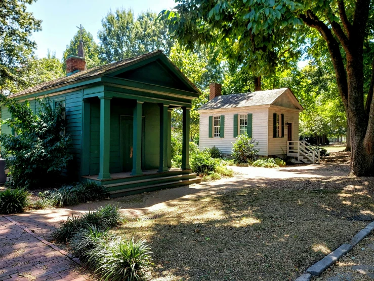 the little building is located near a tree