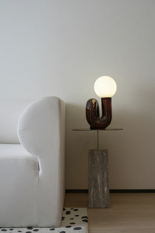an abstract glass lamp on a wooden table