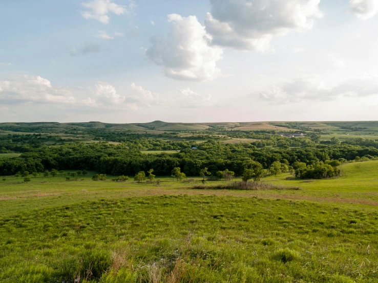 a view of some big pretty green hills and land