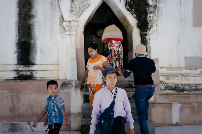 an image of a group of people coming out of a building