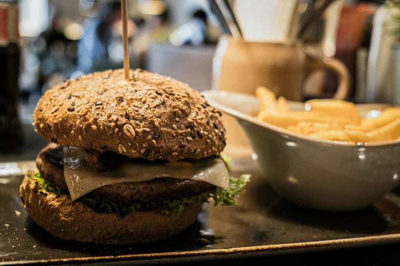 a close up of a sandwich and some fries