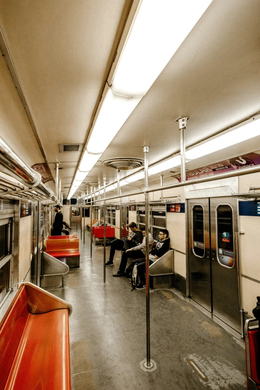 an image of a subway train with people on it