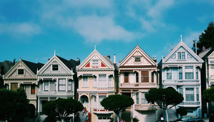 a group of houses that are painted in different colors