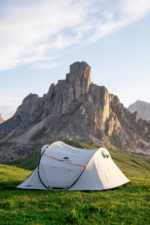 a tent set up in the mountains with a view