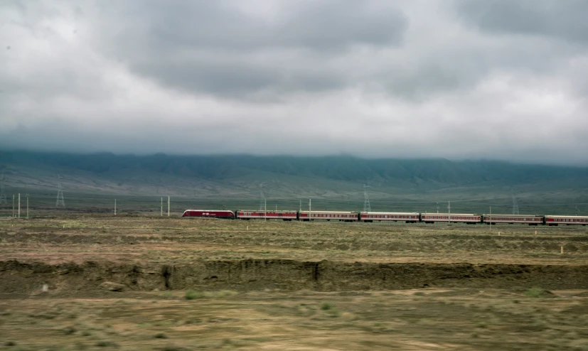 the train is traveling along the railroad tracks