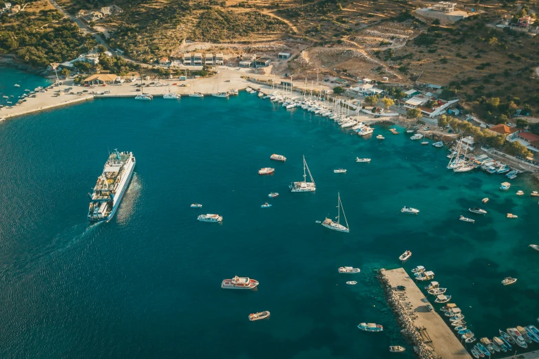 an aerial po shows boats floating on a bay