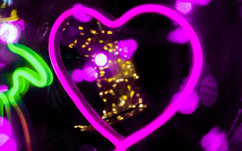 a heart shaped object is lit up with color