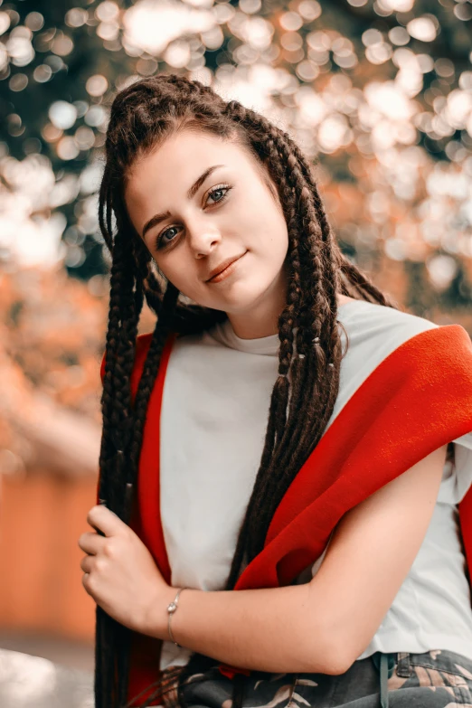 a woman with dreadlocks posing for a po