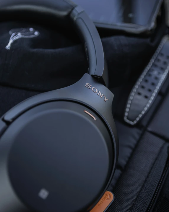 the sony headphones sitting on top of a briefcase