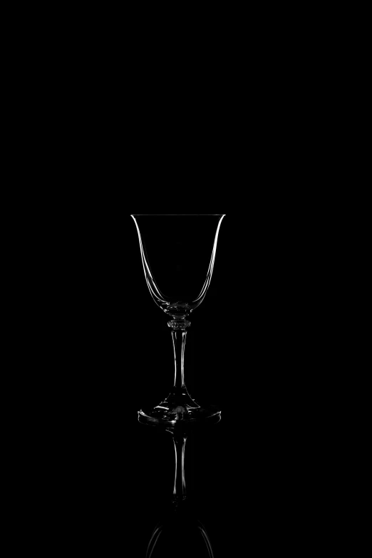 an empty glass sitting on top of a table