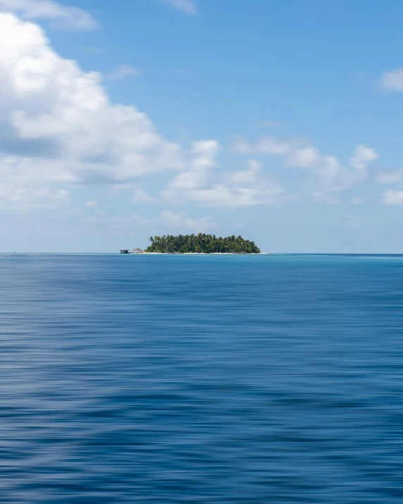 an island sits in the middle of the ocean