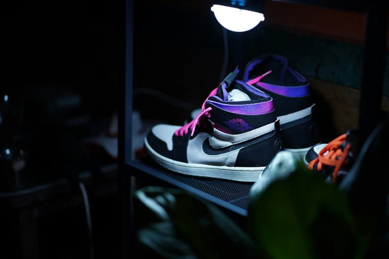 two shoes with glowing soles are on a ledge