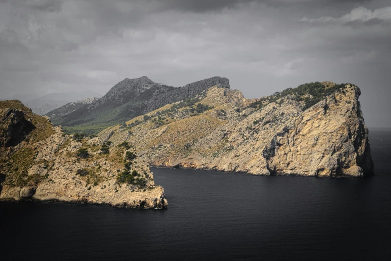 an island with rocks is shown on the ocean