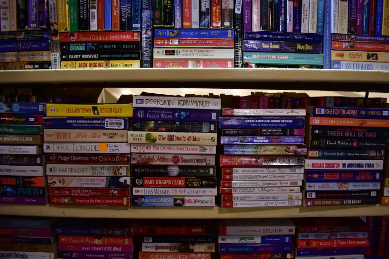 the shelves of books are full of different types of books