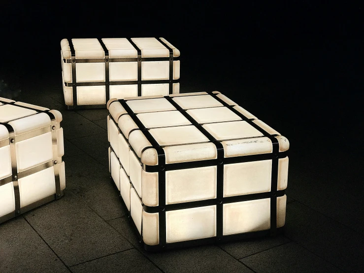 three cubes illuminated by white light from behind