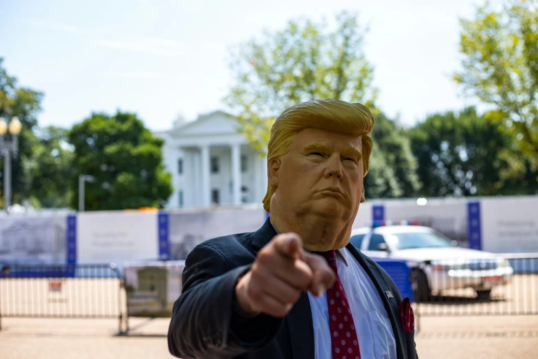 a giant fake president donald trump pointing out his finger